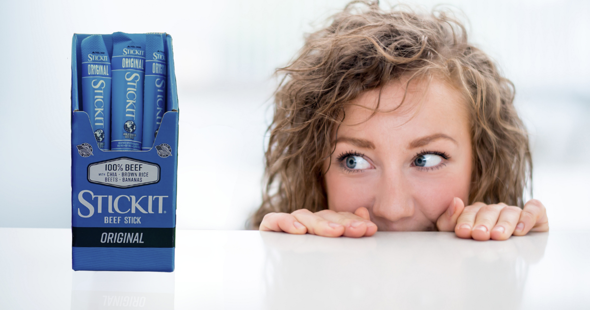 Woman looking at low-carb beef sticks to satisfy cravings